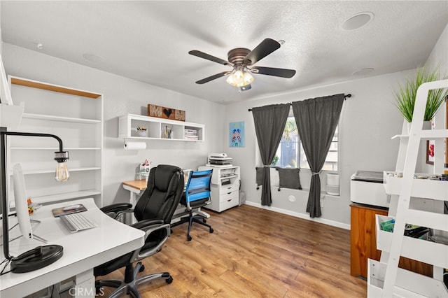 7189 Myrtle Pl, Fontana, CA 92336 - office space featuring a ceiling fan, wood finished floors, a textured ceiling, and baseboards