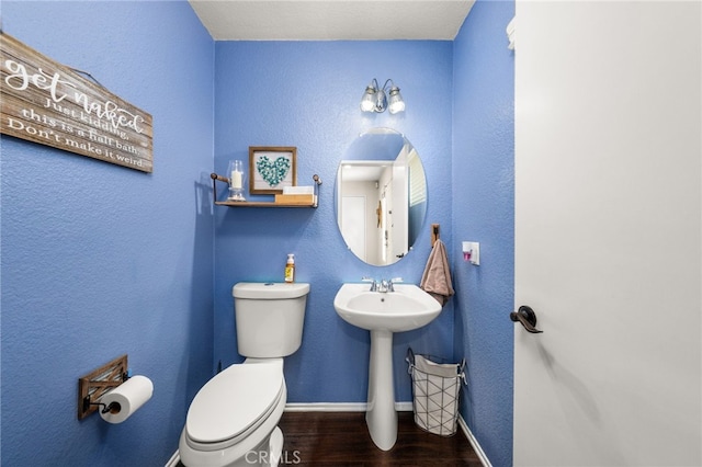 7189 Myrtle Pl, Fontana, CA 92336 - bathroom with wood finished floors, toilet, and baseboards