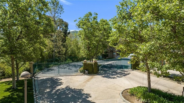587 Fenwick Way Unit B, Simi Valley, CA 93065 - view of concrete driveway with a gate and a gated entry