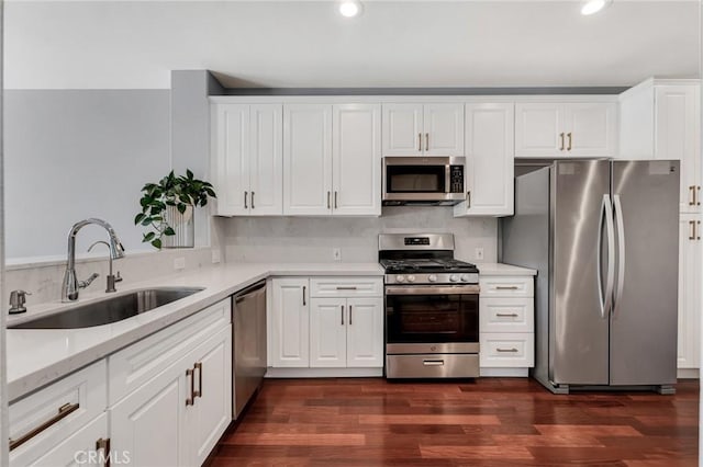 587 Fenwick Way Unit B, Simi Valley, CA 93065 - kitchen featuring appliances with stainless steel finishes, a sink, recessed lighting, white cabinets, and dark wood finished floors
