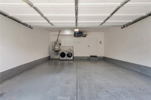 587 Fenwick Way Unit B, Simi Valley, CA 93065 - garage featuring washer and clothes dryer and secured water heater