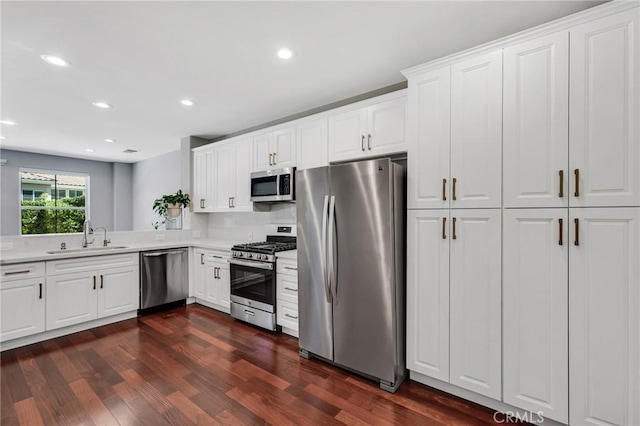 587 Fenwick Way Unit B, Simi Valley, CA 93065 - kitchen with stainless steel appliances, a sink, light countertops, dark wood-style flooring, and recessed lighting