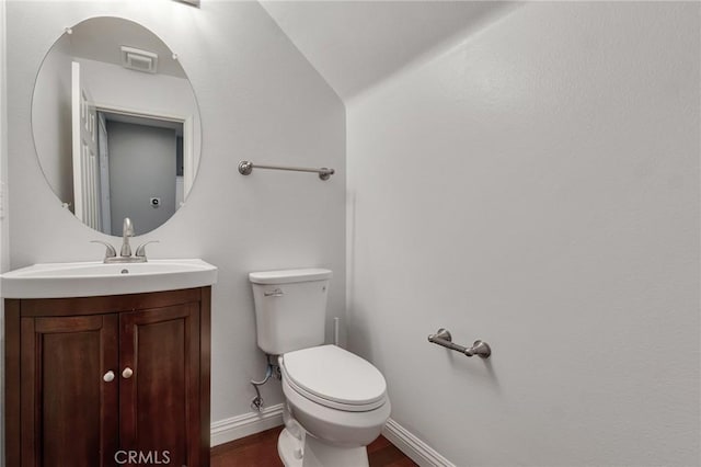 587 Fenwick Way Unit B, Simi Valley, CA 93065 - half bathroom with toilet, wood finished floors, vanity, and baseboards