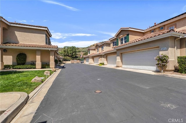 587 Fenwick Way Unit B, Simi Valley, CA 93065 - view of asphalt road featuring a residential view and curbs