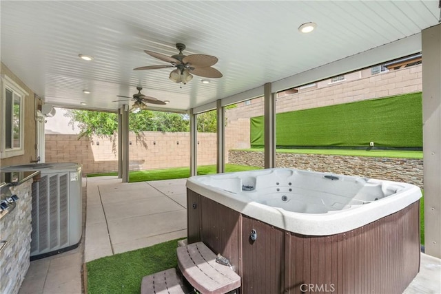 view of patio with a hot tub, central air condition unit, fence, and a ceiling fan