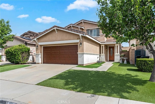 view of front of home with stucco siding, an attached garage, driveway, and a front yard