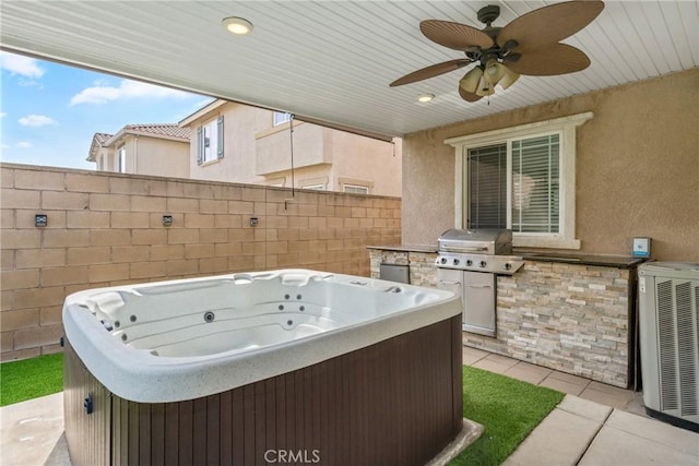 view of patio / terrace featuring a hot tub, area for grilling, fence, ceiling fan, and central AC