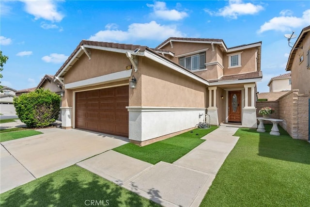 view of front of house with stucco siding, a garage, and driveway