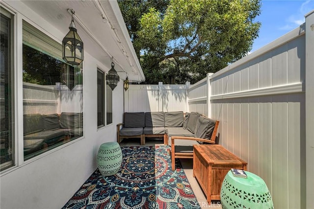view of patio with fence and an outdoor hangout area