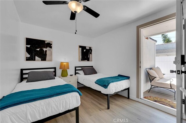 bedroom featuring wood finished floors and a ceiling fan