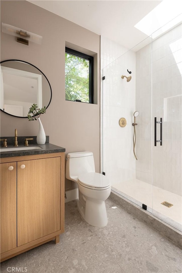 full bath with toilet, a shower stall, and vanity