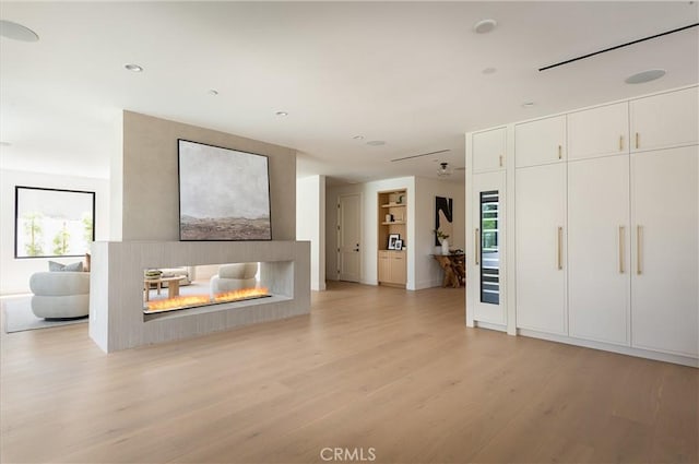entryway featuring light wood-style flooring, plenty of natural light, and recessed lighting