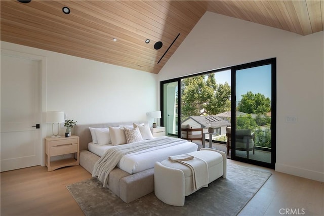 bedroom with access to exterior, wood ceiling, wood finished floors, and high vaulted ceiling