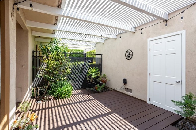 wooden deck with a pergola