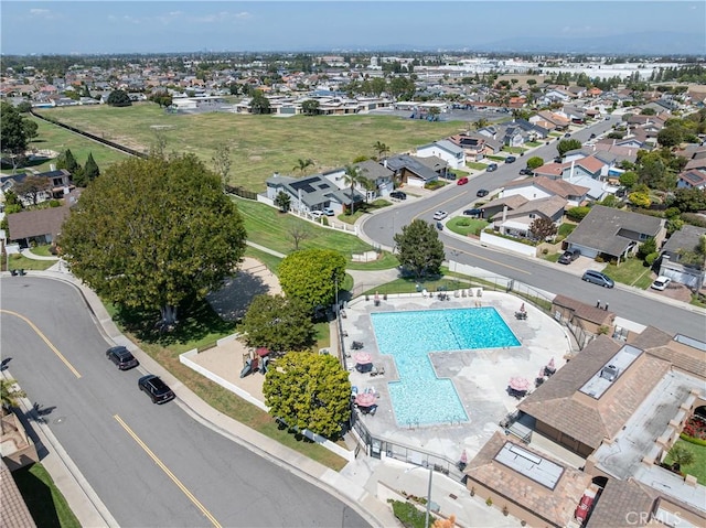 aerial view of residential area featuring a pool