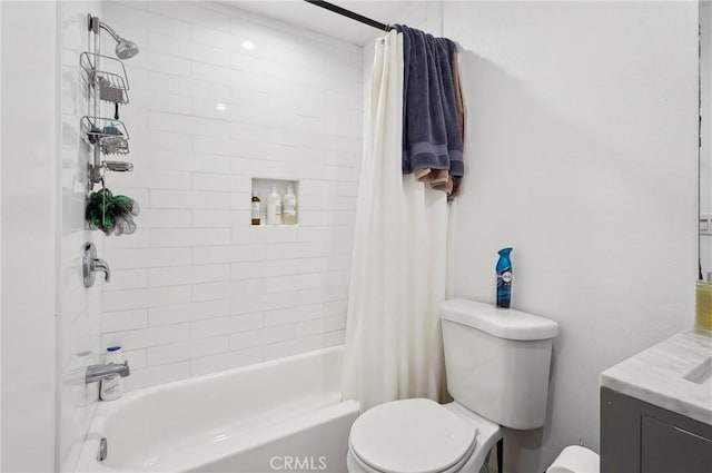bathroom with toilet, shower / bath combo, and vanity
