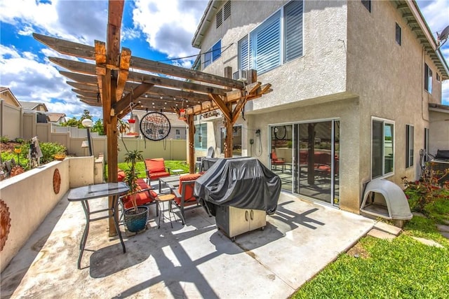 view of patio / terrace with a pergola and fence