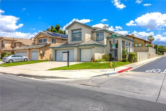 view of property featuring stucco siding, a garage, driveway, fence, and a residential view