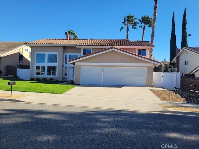 2848 Jadestone Ave, Simi Valley, CA 93063 - traditional-style house featuring an attached garage, concrete driveway, a tiled roof, stucco siding, and a gate