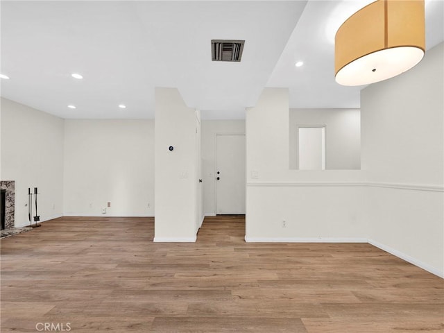 20155 Keswick St Unit 117, Winnetka, CA 91306 - unfurnished living room with recessed lighting, wood finished floors, and a fireplace with raised hearth
