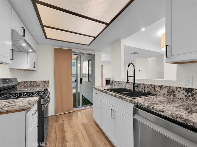 20155 Keswick St Unit 117, Winnetka, CA 91306 - kitchen with gas stove, dishwasher, a sink, ventilation hood, and light wood finished floors