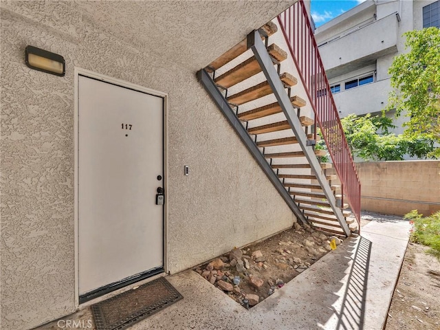 20155 Keswick St Unit 117, Winnetka, CA 91306 - view of exterior entry featuring stucco siding