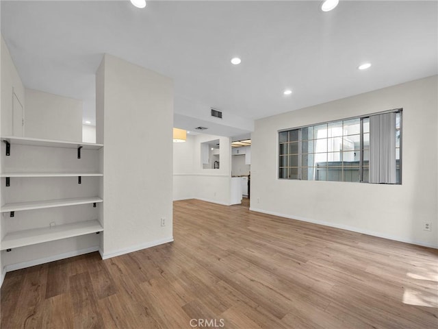 20155 Keswick St Unit 117, Winnetka, CA 91306 - unfurnished living room with wood finished floors, recessed lighting, and baseboards