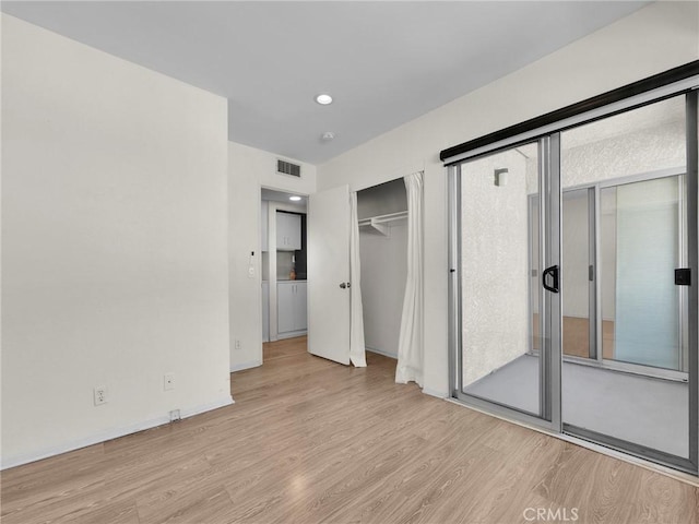 20155 Keswick St Unit 117, Winnetka, CA 91306 - unfurnished bedroom with wood finished floors, recessed lighting, and baseboards
