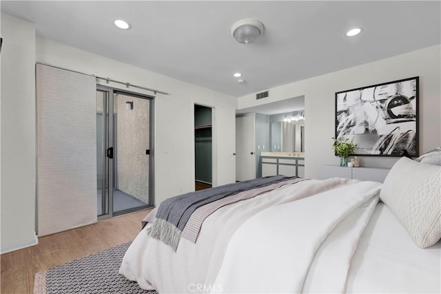 20155 Keswick St Unit 117, Winnetka, CA 91306 - bedroom featuring wood finished floors, access to outside, and recessed lighting