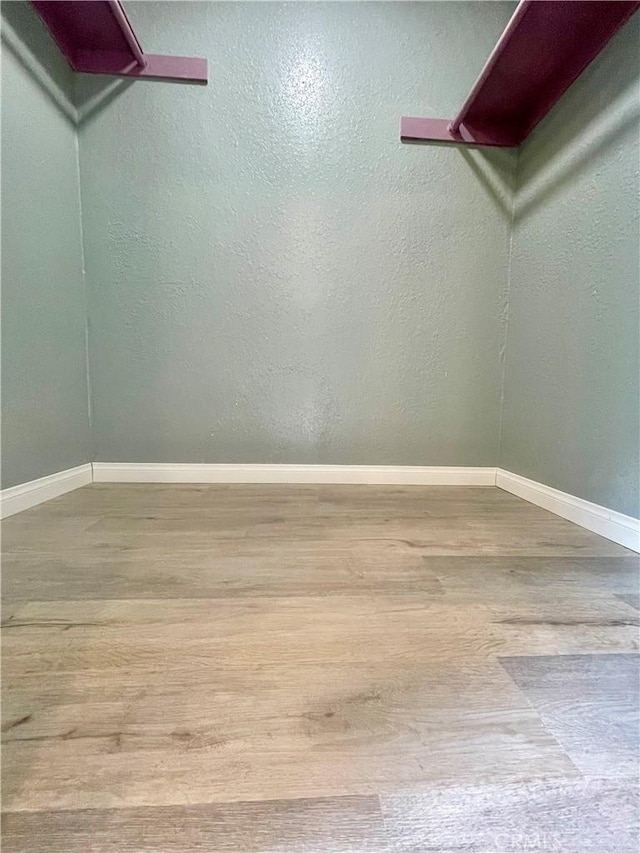 20155 Keswick St Unit 117, Winnetka, CA 91306 - walk in closet featuring wood finished floors