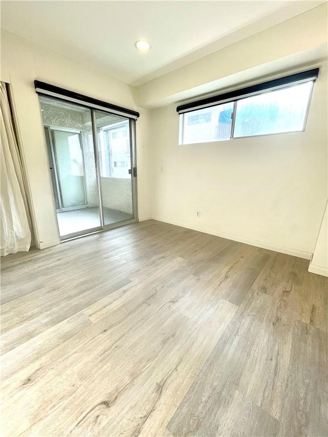 20155 Keswick St Unit 117, Winnetka, CA 91306 - spare room featuring wood finished floors and recessed lighting