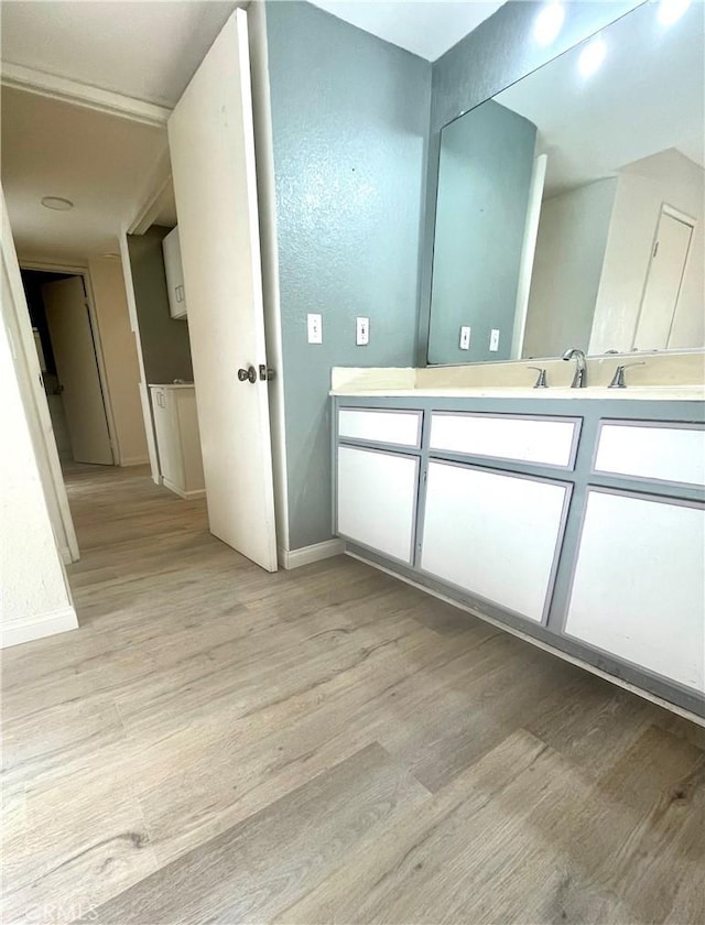 20155 Keswick St Unit 117, Winnetka, CA 91306 - bathroom featuring wood finished floors and vanity