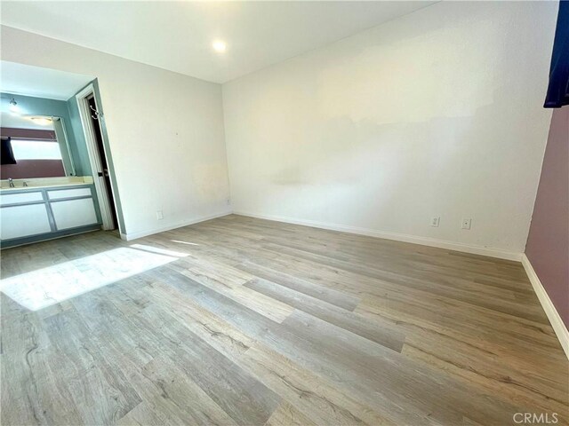 20155 Keswick St Unit 117, Winnetka, CA 91306 - spare room with wood finished floors and baseboards