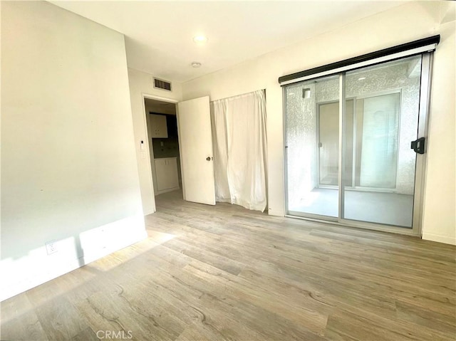 20155 Keswick St Unit 117, Winnetka, CA 91306 - unfurnished bedroom featuring wood finished floors, access to outside, and recessed lighting