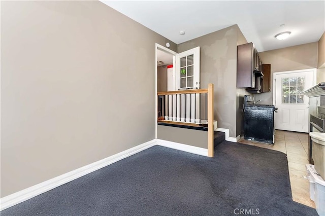 576 Rose Ln, Twin Peaks, CA 92391 - kitchen with range, baseboards, and dark brown cabinets