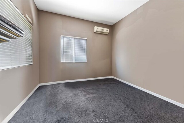 576 Rose Ln, Twin Peaks, CA 92391 - empty room with carpet flooring, a wall mounted AC, and baseboards