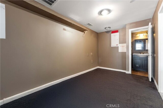 576 Rose Ln, Twin Peaks, CA 92391 - spare room with dark carpet and baseboards
