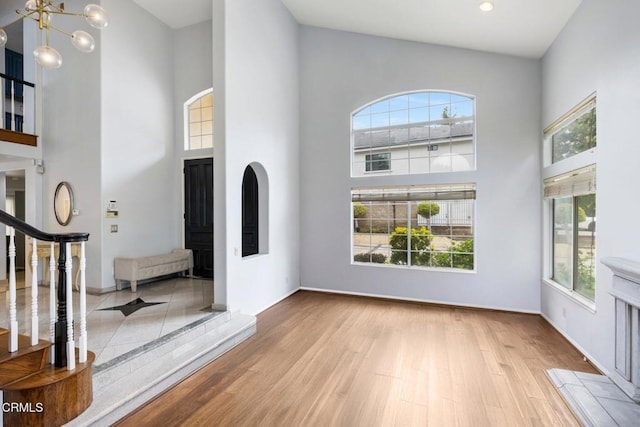 1985 Erin Way, Glendale, CA 91206 - entrance foyer with a high ceiling, wood finished floors, a chandelier, baseboards, and stairs
