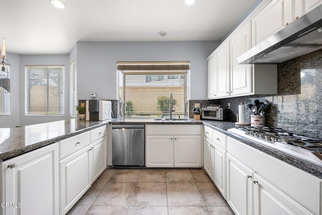 1985 Erin Way, Glendale, CA 91206 - kitchen with appliances with stainless steel finishes, under cabinet range hood, recessed lighting, backsplash, and white cabinets