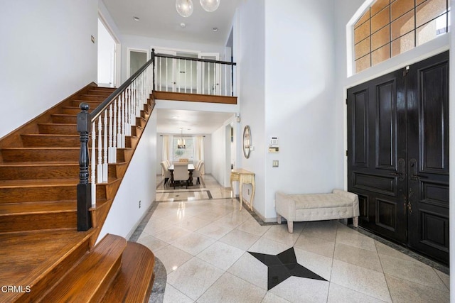 1985 Erin Way, Glendale, CA 91206 - foyer featuring a towering ceiling, stairs, and light tile patterned floors