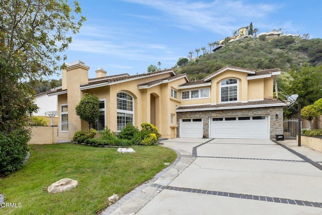1985 Erin Way, Glendale, CA 91206 - view of front of house featuring stucco siding, a garage, concrete driveway, a chimney, and stone siding
