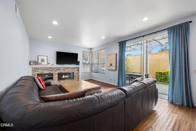 1985 Erin Way, Glendale, CA 91206 - living room featuring wood finished floors, a stone fireplace, and recessed lighting