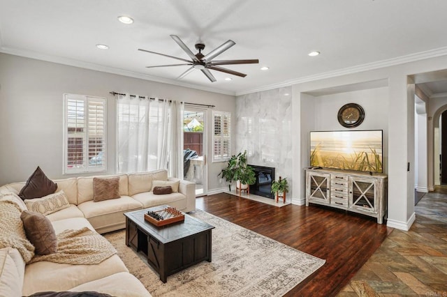 32555 Safflower St, Winchester, CA 92596 - living area with a ceiling fan, recessed lighting, baseboards, a fireplace, and ornamental molding