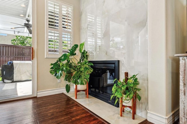 32555 Safflower St, Winchester, CA 92596 - living area with wood finished floors, a ceiling fan, baseboards, and a high end fireplace