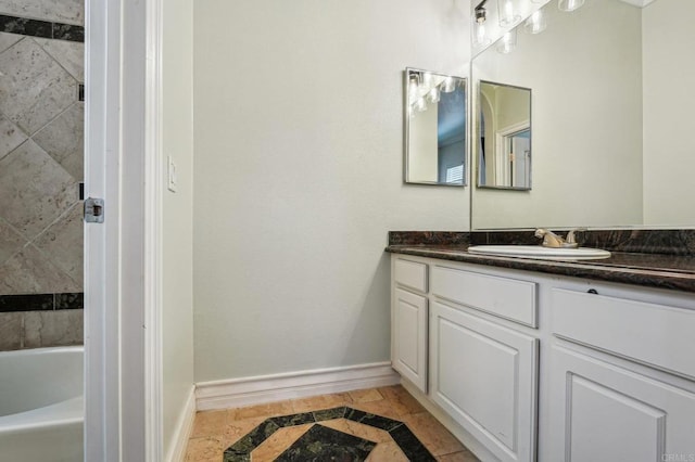 32555 Safflower St, Winchester, CA 92596 - bathroom with inlaid floor details, vanity, baseboards, a bath, and a shower
