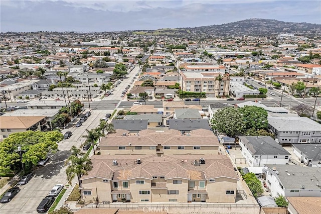 view of property location with a mountainous background and nearby suburban area