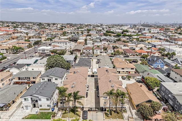 aerial view of property and surrounding area with nearby suburban area