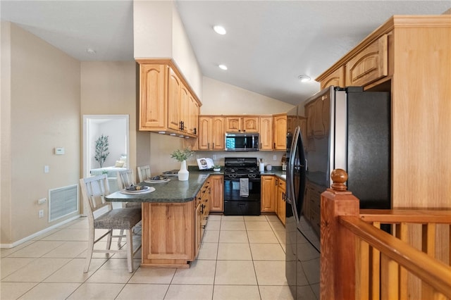 41225 Hacienda Dr, Murrieta, CA 92562 - kitchen with black appliances, dark countertops, a kitchen bar, light tile patterned flooring, and vaulted ceiling