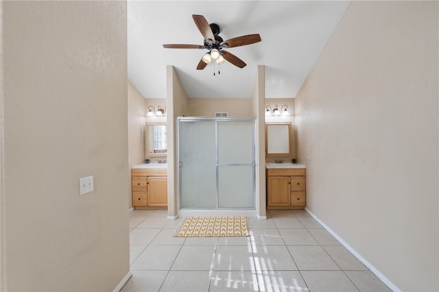 41225 Hacienda Dr, Murrieta, CA 92562 - bathroom featuring two vanities, a shower stall, ceiling fan, tile patterned flooring, and lofted ceiling