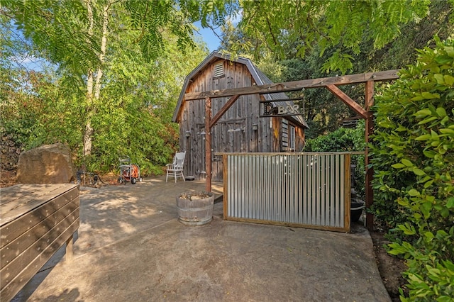 41225 Hacienda Dr, Murrieta, CA 92562 - gate with a barn, an outdoor structure, and a patio area
